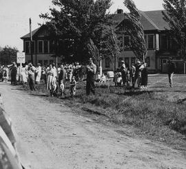 Spectators at May Day 1960 parade in front of Mashiter School