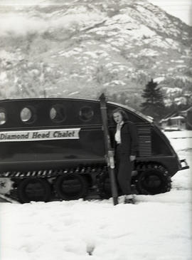 Woman and snowmobile