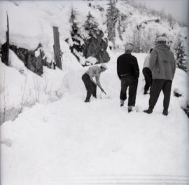 Digging on snowmobile trip