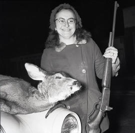 Woman with dead deer