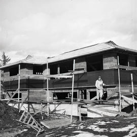 Man constructing building