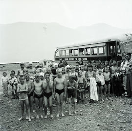 Kids on beach by bus