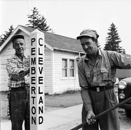 Men by Pemberton/Cleveland sign