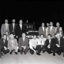 Group of men with ambulance