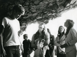 Young people looking at rocks