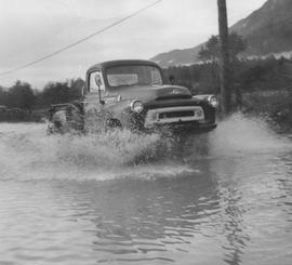 Squamish Mills truck riding over flooded road