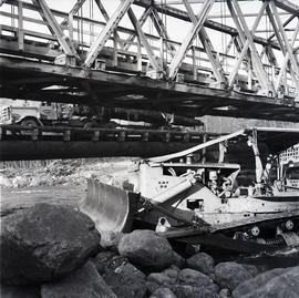 Truck under bridge