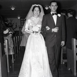 Bride and groom walking down aisle