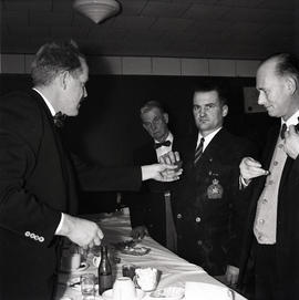 Men at table with medal [Legion event?]