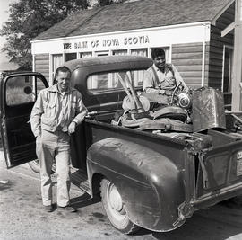 Men with truck in front of Bank of Nova Scotia