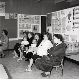 Women and young children as audience [?] in classroom