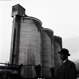 Man and industrial buildings