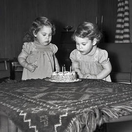 Little girls with cake