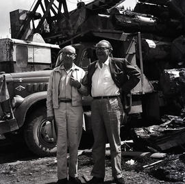 Men and logging truck