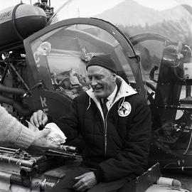 Man with Olympic badge and helicopter