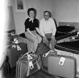 Man and woman with suitcases