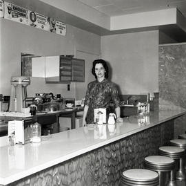 Woman behind counter in diner