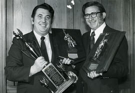 Hon. E. Hall (left) and N. Keziere with awards