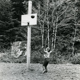 Child shooting baskets