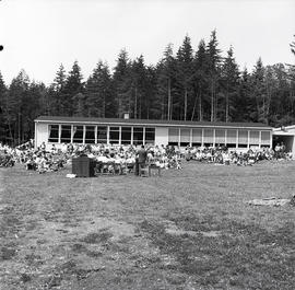 Crowd by building [school?]