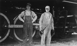 Mr Machain and James Eadie standing outside train engine